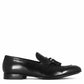 Elegant men's loafer in soft black leather with tassels